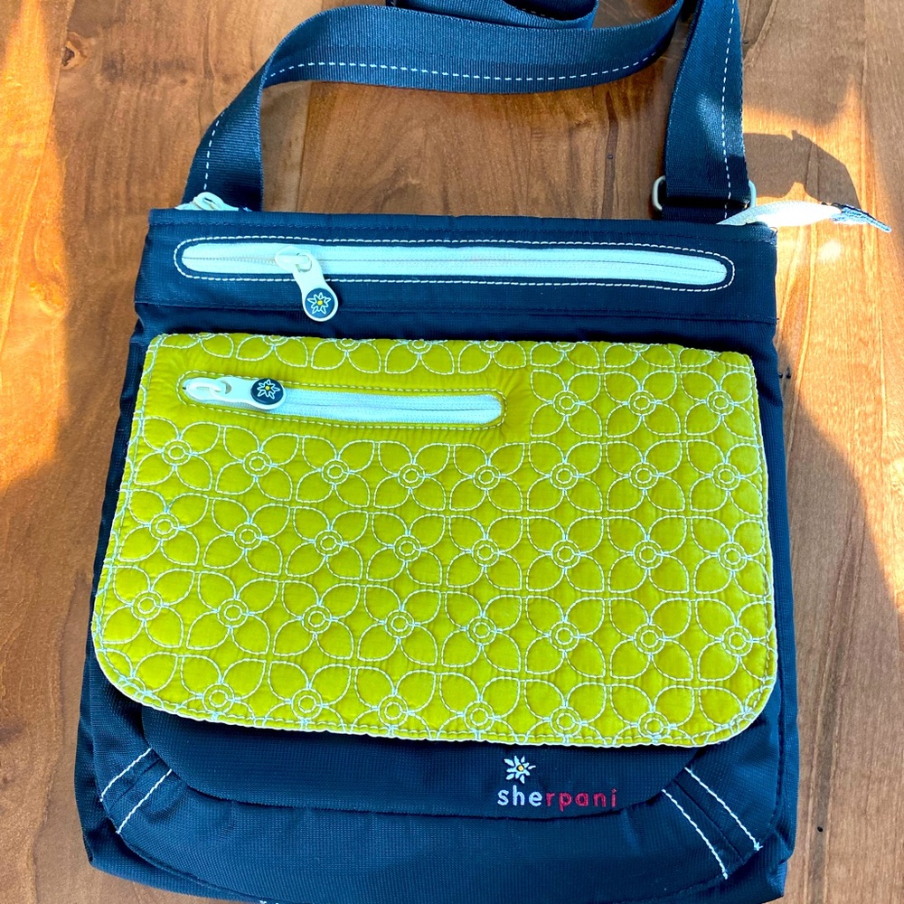 Very gently used Sherpani shoulder/cross body bag; lime green, black, and cream